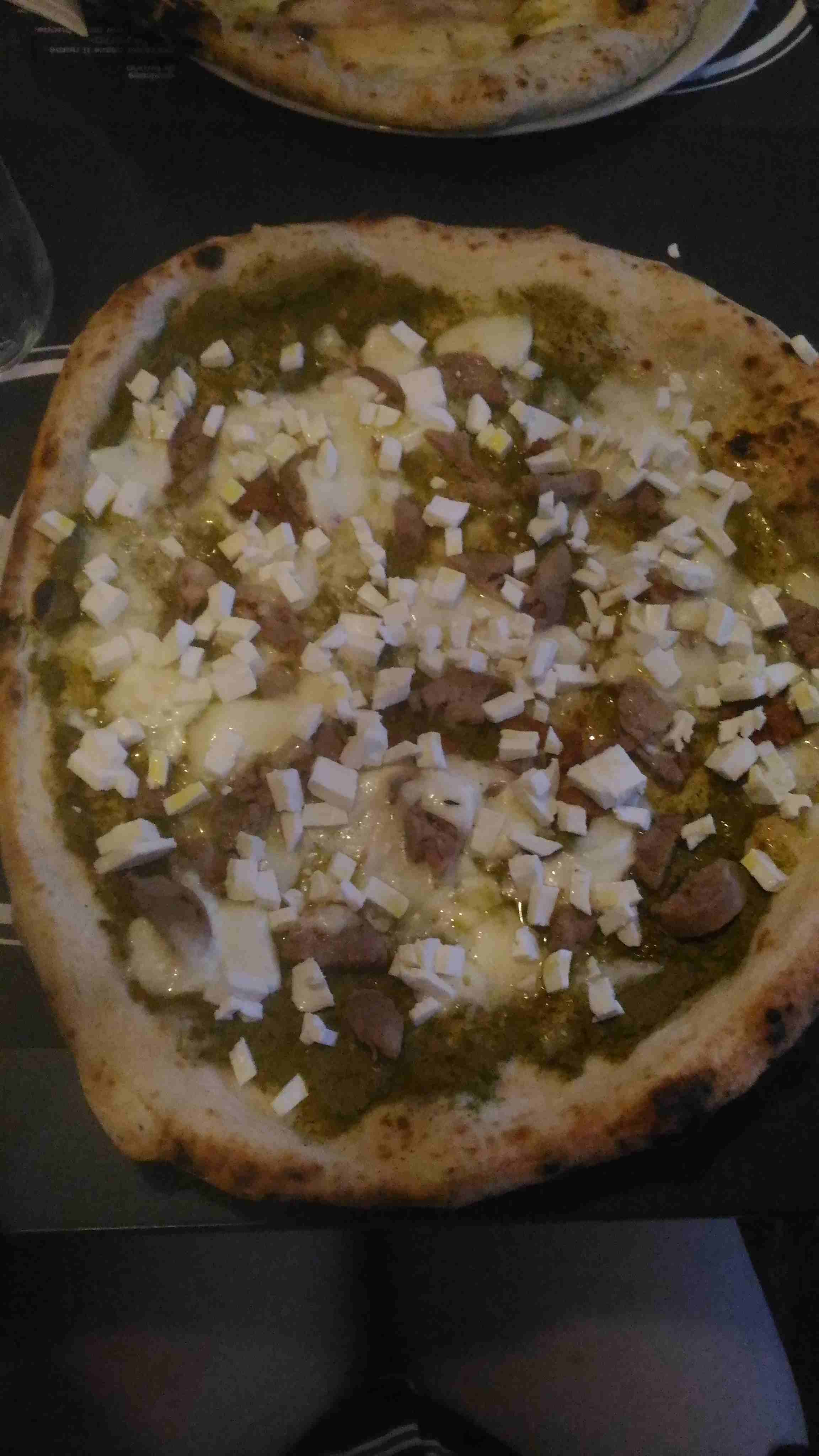 Broccoli, sausage and buffalo mozzarella pizza.